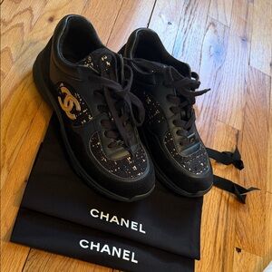CHANEL Black Sneakers with Gold Detailing